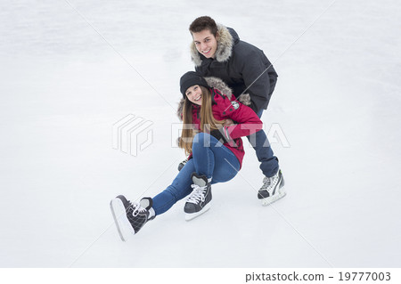 图库照片: ice skating couple having winter fun on ice skates