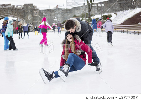 图库照片: ice skating couple having winter fun on ice skates