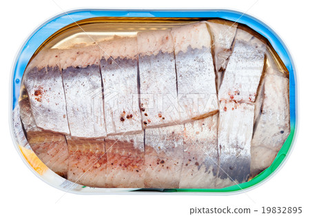 图库照片: canned marinated herring in brine isolated