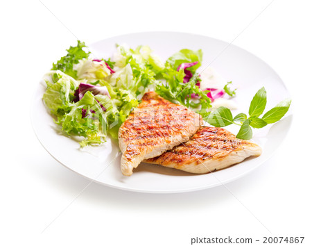 图库照片: plate of grilled chicken breast with salad