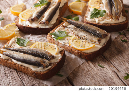 图库照片: fish sandwiches with cream cheese and lemon