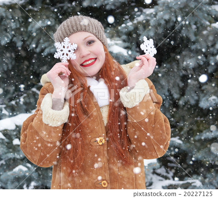girl portrait at winter outdoor, snowy weather, showing big snow