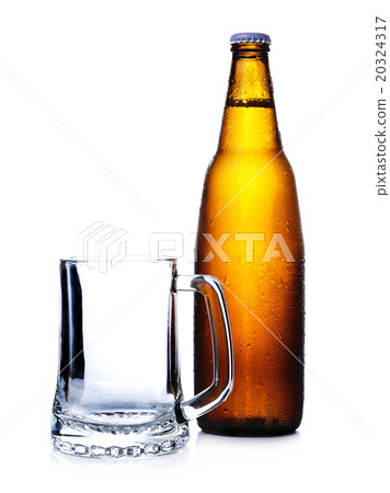 图库照片: bottle of beer and empty glass on white background