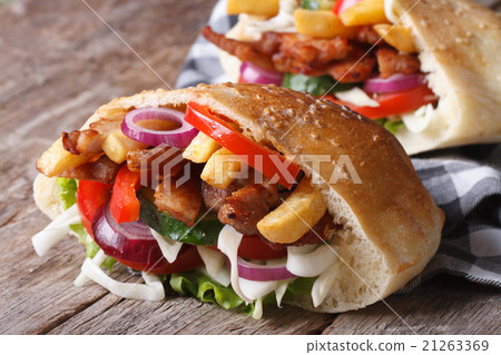 图库照片: two doner kebab with meat, vegetables and fries