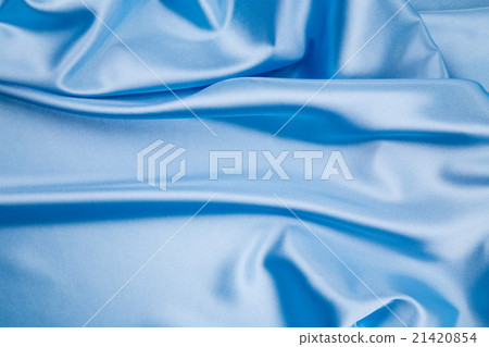 图库照片: blue silk cloth texture closeup.