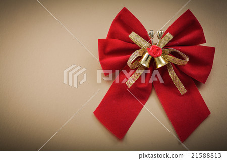 图库照片: red bow on golden background holidays concept