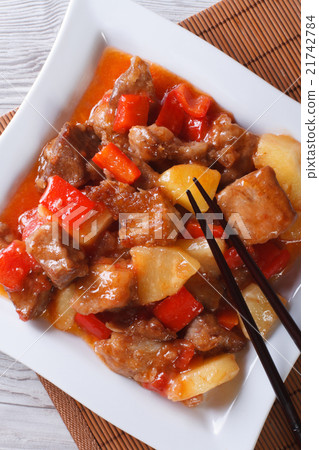 图库照片: asian pork with pineapple in sweet and sour sauce