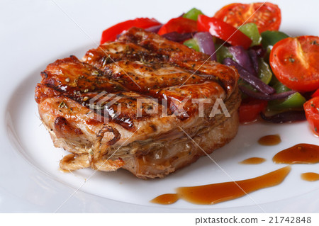 图库照片: delicious pork steak with vegetables and sauce