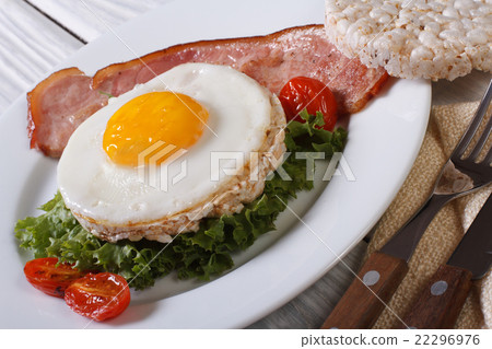 图库照片: fried eggs with bacon and vegetable and rice bread