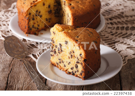 图库照片: cut a piece of cake with chocolate on the plate