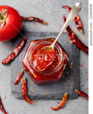 图库照片: tomato and chili sauce, jam, confiture glass jar