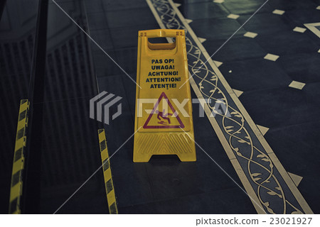 图库照片: sign showing warning of caution wet floor