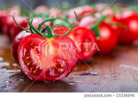 图库照片: fresh cherry tomatoes washed clean water.