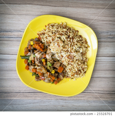 图库照片: chicken meat with fried rice and vegetables