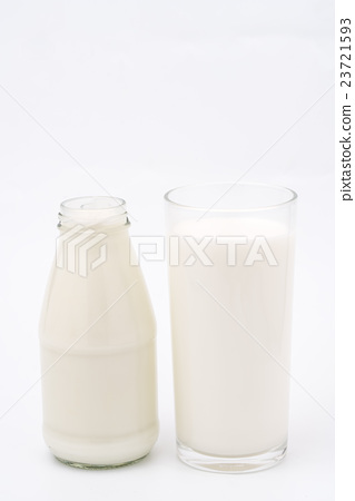 图库照片: bottle and glass of milk isolated on white