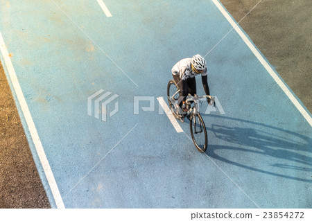 图库照片: bicycle lane and biker riding, top view