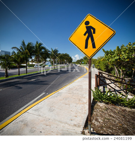 图库照片: pedestrian crossing sign on the street