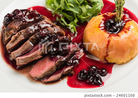 图库照片: roasted beef with berry sauce