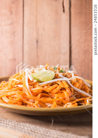 图库照片: fried rice noodles topped with pork