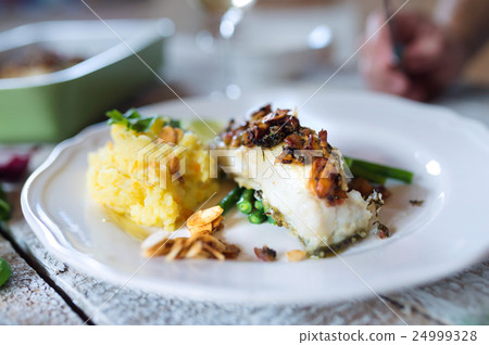 图库照片: zander fish fillet dish on a plate, wooden table