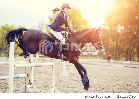 horse rider,riderkick 图库照片: young rider girl on horse show jumping competition