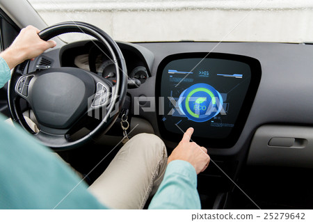 MODE,reset 图库照片: man driving car with eco mode on board computer