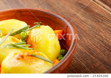 图库照片: boiled and baked potato and vegetables