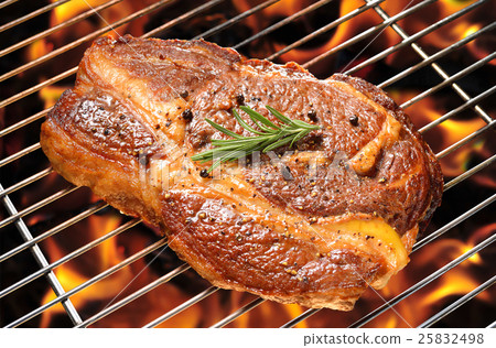 图库照片: grilled beef steak on the flaming grill, rib-eye