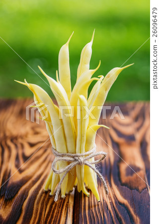 图库照片: organic yellow beans (french beans) on wood