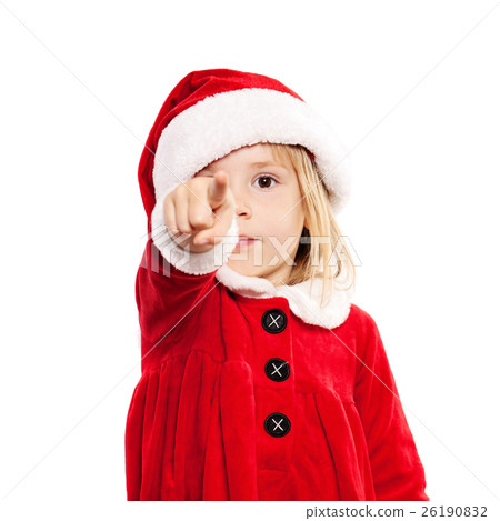 图库照片: christmas child in santa hat point the finger