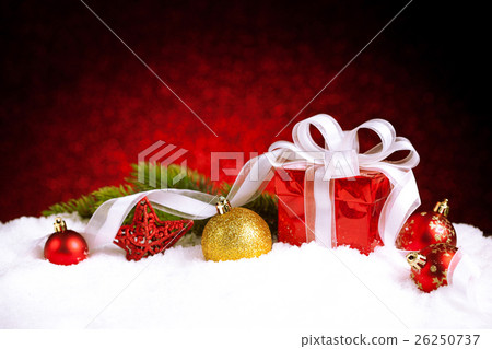 图库照片: christmas gift box with balls, stars and