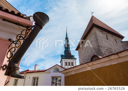 图库照片: rain water downspout and view of tallinn, estonia