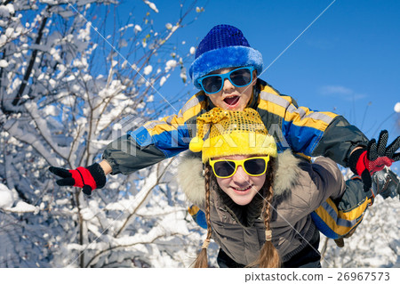 图库照片: happy little children playing in winter snow day.