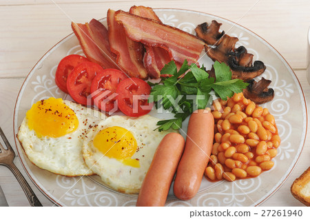 图库照片: fried eggs with bacon, tomatoes, beans, mushrooms