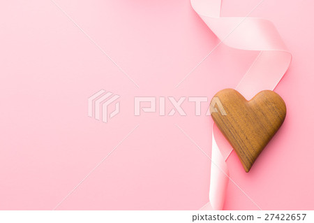 图库照片: wooden heart and pink ribbon.