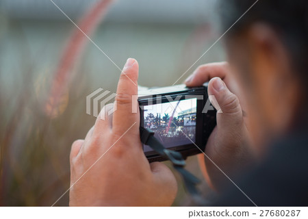 图库照片 close up of man hand taking picture by digital camera