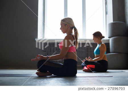 图库照片: young women in yoga class, relax meditation pose