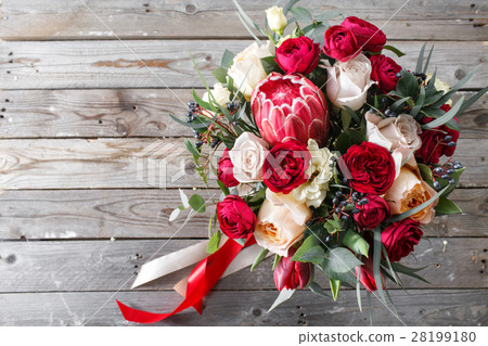 图库照片: bouquet of red roses and other colors flowers on