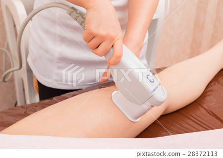 图库照片: 腿腿美容设备足部按摩美容图像美容女性放松美容形象