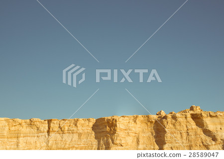 图库照片: cliff of the yellow orange brown sand soil clay