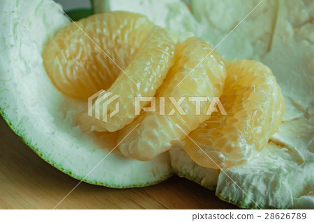 图库照片: pomelo or grapefruit. fresh tropical fruit.