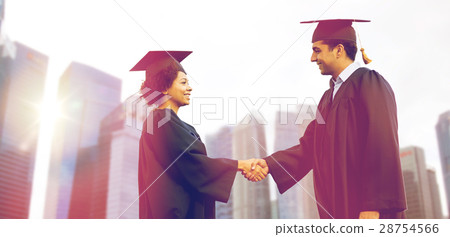 图库照片 happy students or bachelors greeting each other