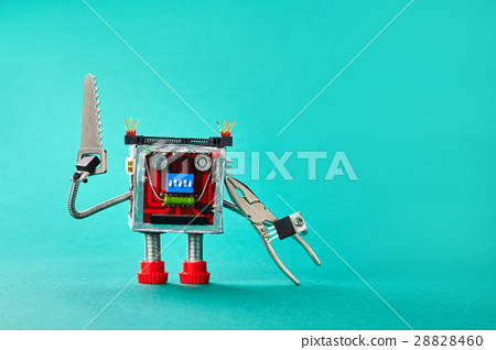 serviceman,dimly lit 图库照片: handsaw pliers serviceman robot on cyan paper