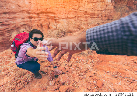 图库照片 close-up of helping hand hiking help each other.