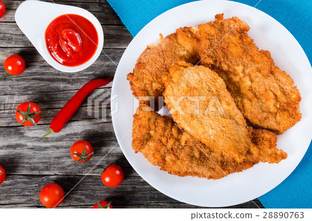 图库照片: bread crumb coated fried chicken breast