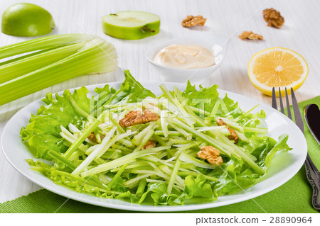 图库照片: waldorf salad with walnuts, green apple and celery