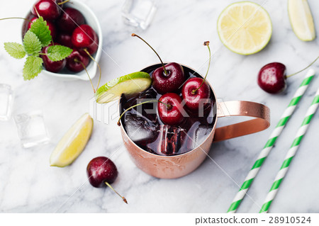 图库照片 cold cherry moscow mule cocktail marble background