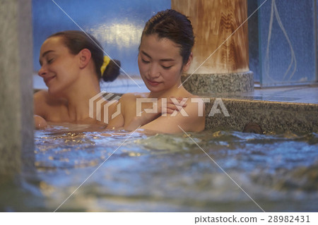 stock photo: foreign women enjoying hot spring trip and japanese