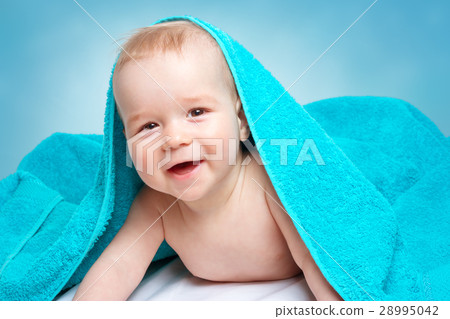 图库照片: cute baby in a towel