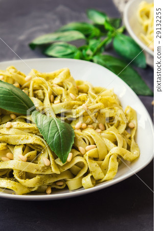 图库照片: fettuccine pasta with pesto sauce